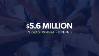 hands put together in a circle with white text overlaid that reads: "$5.6 million in GO Virginia funding"