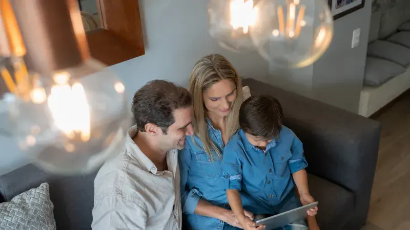 Family sitting together with ipad